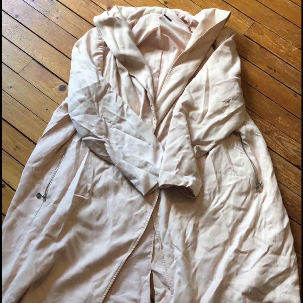 Light pink long jacket. Size is either a 1x or 2x in the plus size section